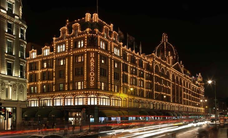 Exterior view of Harrods at night time